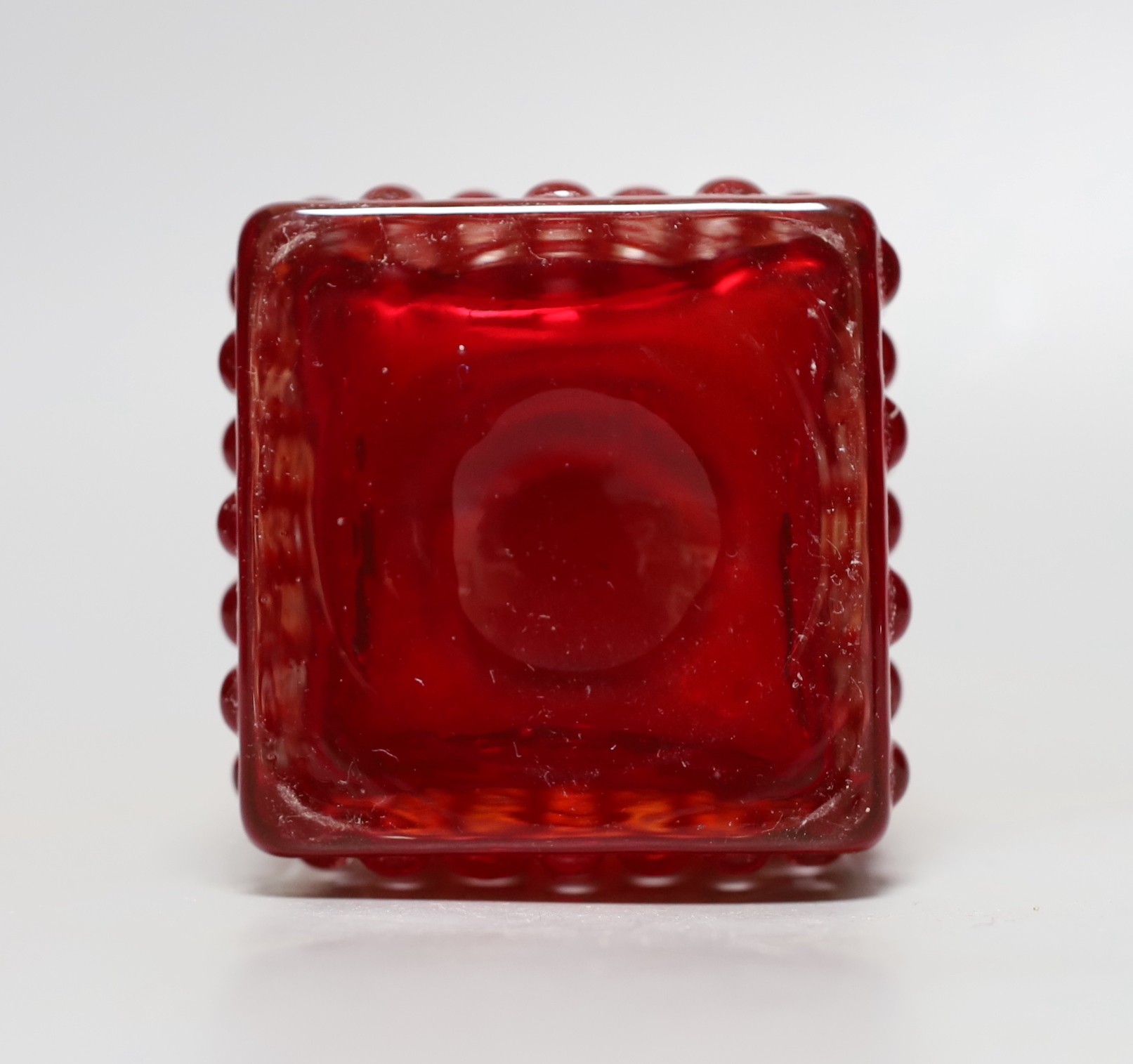 A Whitefriars 'Chess' glass vase, designed by Geoffrey Baxter, pattern number 9817, red glass, 14.5cm tall